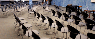 Image of chairs lined up in meeting room.