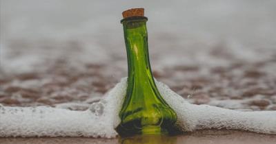 Message in a Bottle floating to shore