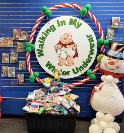 Captain Underpants with snowman and donations