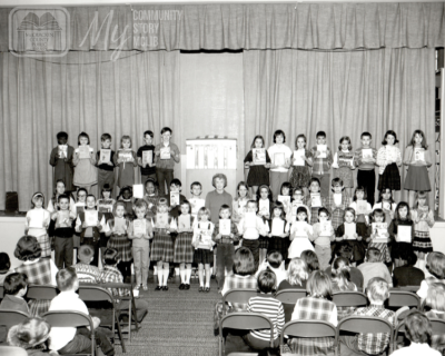 Black and white photograph of Harriett Boswell with children at the Paducah Carnegie Library