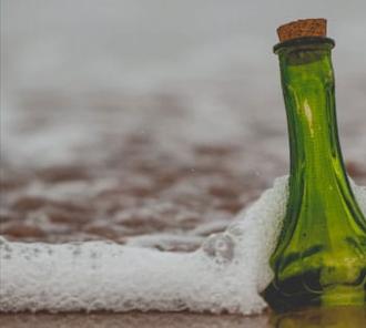 Message in a Bottle floating to shore